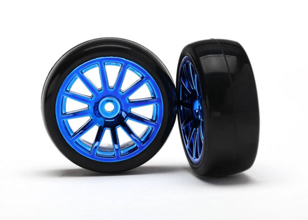7573R Traxxas Tires & wheels, assembled, glued (12-spoke blue)