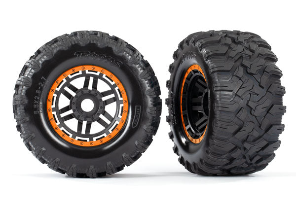 8972T  Tires & wheels, assembled, glued (black, orange beadlock style wheels, Maxx® MT tires, foam inserts) (2) (17mm splined) (TSM® rated)